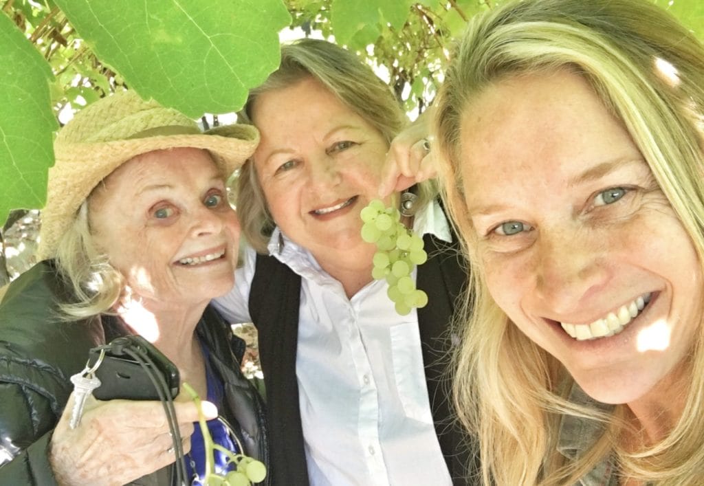 Lucetta, Gabriele and Nicole eating biodynamic grown grapes