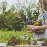 woman with herbs in garden