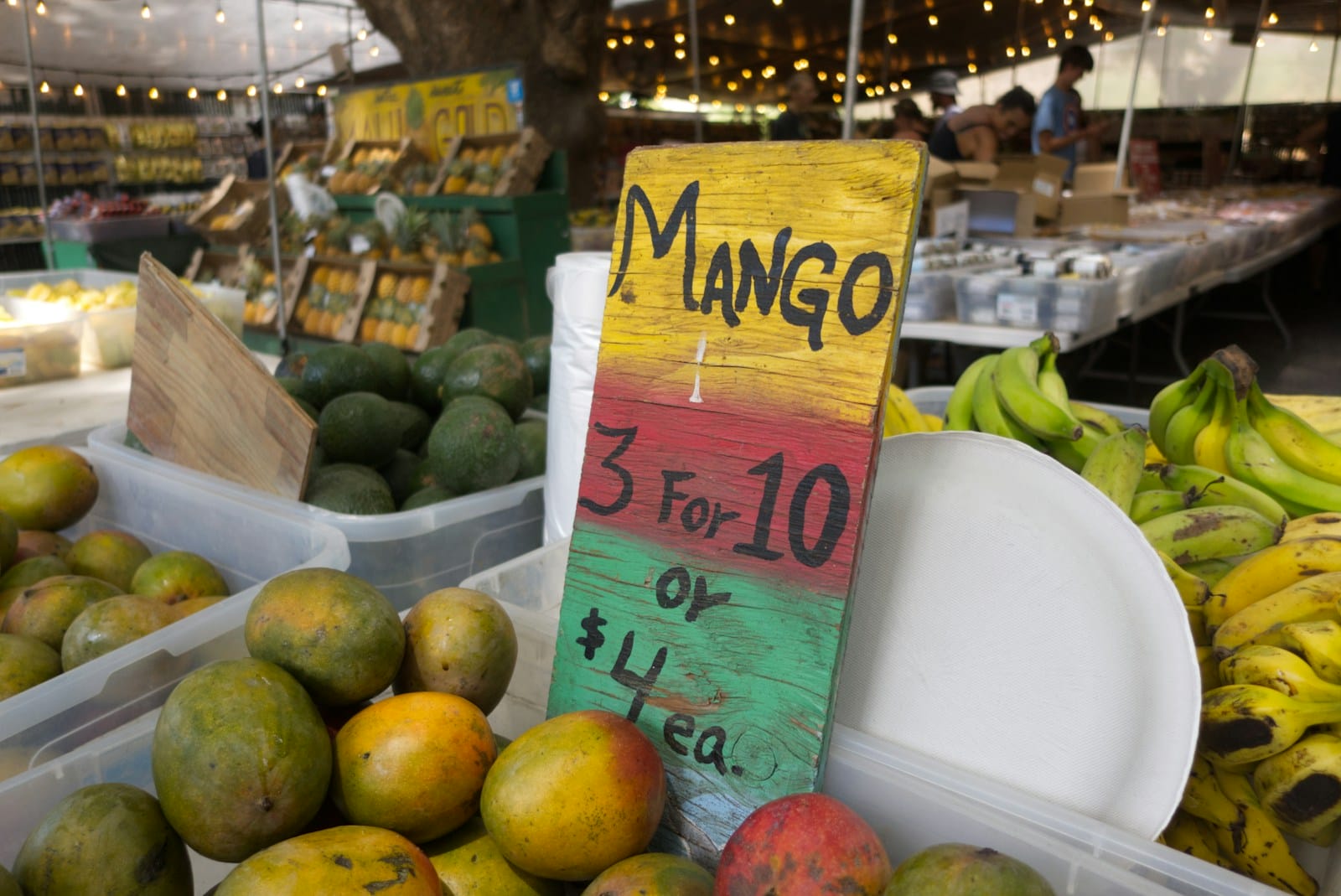 a bunch of fruits and vegetables are on display